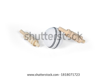 cricket ball and bails, red ball and white ball isolated on white background,  studio shot cutout