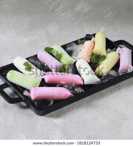 Fruit Ice yoghurt. On black tray with white background. selected focus or out of focus. 