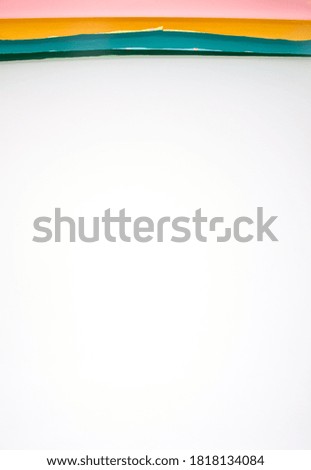 multicolored photography backdrops in a photo studio on the white wall background, free space