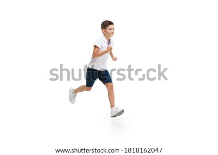 Happy little boy running on white background, happiness Royalty-Free Stock Photo #1818162047