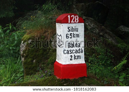 Milestone of kilometer 128 of the DN7C, the famous Transfagarasan road in Romania (Sibiu district). Landmark next to the Balea waterfall, 2 km from it.
