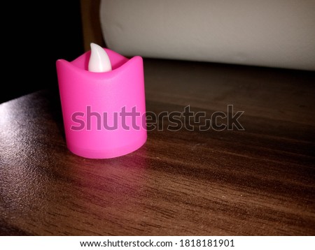 pink candle on table picture