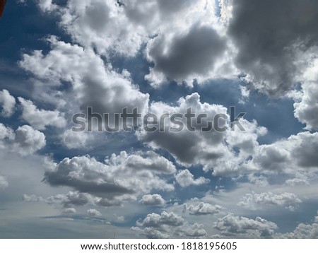 Clouds  Altocumulus big small white clouds cluster together Can see the sky very clearly and very beautiful. quaint take picture a high angle from the plane.