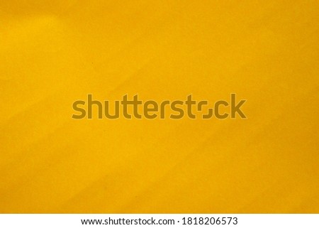 textured of yellow paper for background.
