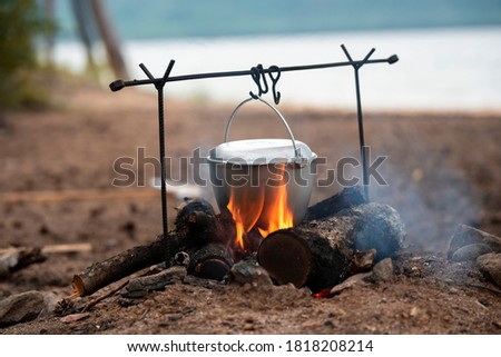 cooking pot over the fire