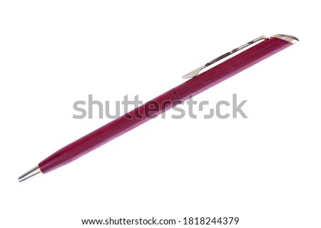 Old vintage ballpoint pen isolated on white background. Red retro metal ballpoint pen isolated