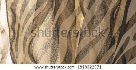 silk fabric with black and beige stripes, zebra skin in African style. For the designer, the sketch of the layout, the entourage of the decorator. Background texture collection