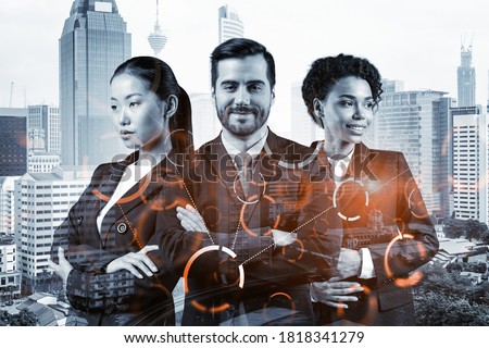 Group of business colleagues working on technology at business process to achieve tremendous growth in commerce. Worldwide process to conduct transactions. Tech hologram icons over Kuala Lumpur