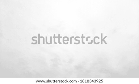 White background of blurred sky and clouds in fade gray tone for natural background design.