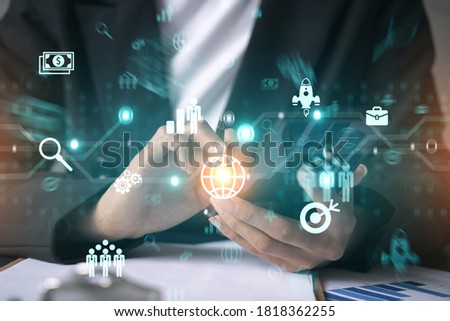 Businesswoman using smart phone in office. Research and development icon map hologram. Strategy concept. Double exposure.