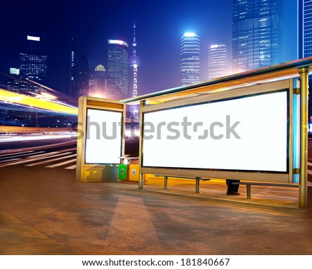 Road car light trails through at modern city advertising light boxes,in shanghai,China
