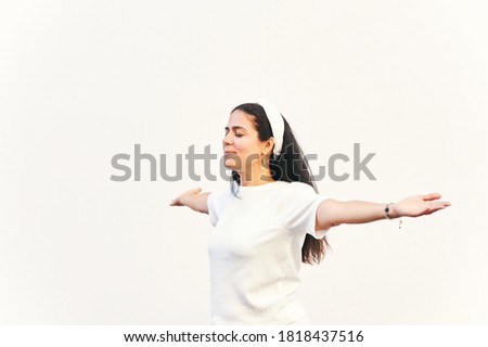 Portrait of happy middle age woman with arms wide open
