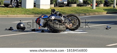 Accident with motorcycle at a crossroads Royalty-Free Stock Photo #1818456800