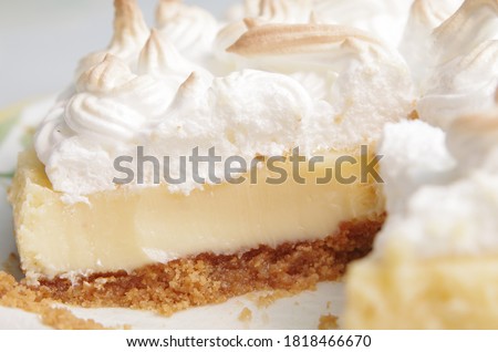 Section of a Lemon pie with meringue surface with stiff peaks. 