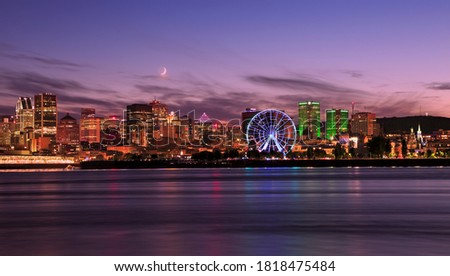 Montreal skyline at dusk reflected in St Lawrence River
