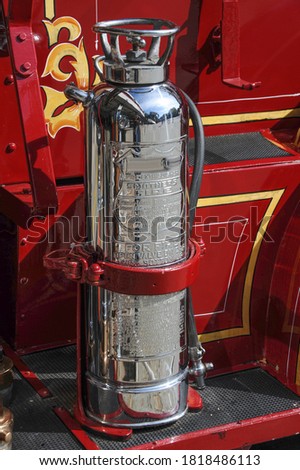 Vintage Chrome Fire Extinguisher on Antique Fire Truck