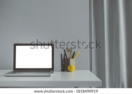 Computer with blank white copy space for text, Mockup design desktop computer in office on white table with keyboard and Coffee cup, Workplace concept.
