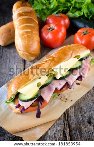 Submarine sandwich with cheese and ham.Selective focus on the front sandwich