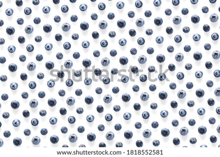 Background of Freshly picked blueberries on white backdrop.
