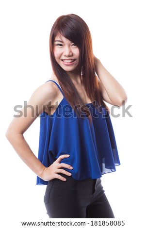 Beautiful young happy asian woman standing on white background