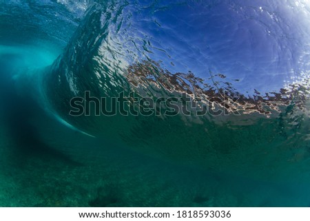 underwater scene of a crashing wave