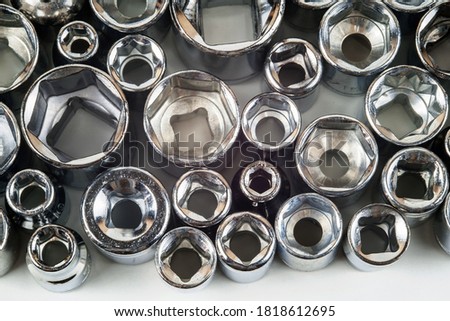 Various different size metal wrench heads closeup. Set of wrench heads collection on the white background, top view