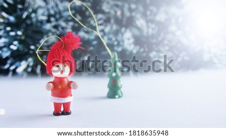  New Year's card, wooden Christmas tree toy. Space for text. New Year's fairy tale. Snowman in a red hat                              