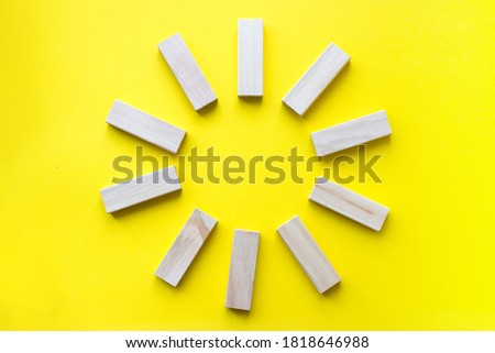 Wooden blocks on yellow. Business planning, Risk Management, Solution, leader, strategy, different and Unique Concepts. Concept of education, risk, development and growth