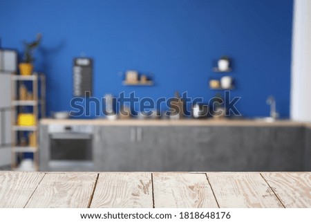 Empty wooden table in modern kitchen
