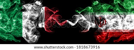 Italy vs Iran, Iranian smoky mystic flags placed side by side. Thick colored silky abstract smoke flags of Italian and Iran, Iranian
