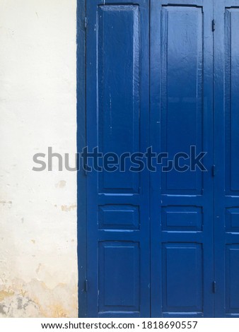 white wall with navy blue paint on wooden wall 