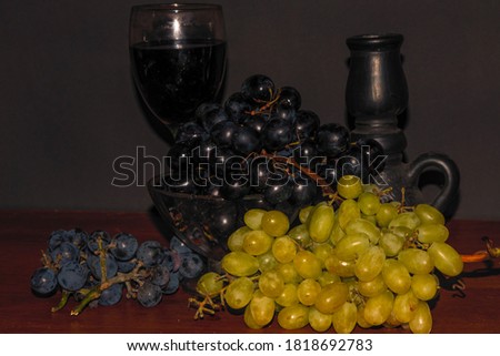 Different fruits stand on a black backgroundShot in soft focus.