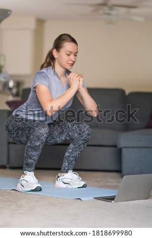 Young lady doing yoga exercises. 
