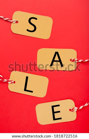 Four tags with the word sale on red background. Top view
