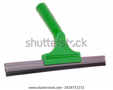 A green plastic squeegee window cleaning utensil on a white background