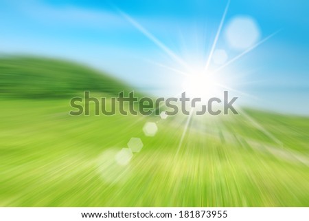 Picture of green field and blue sky, blur, background