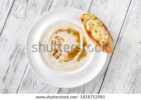 Cauliflower soup with brown butter and cheesy toasts
