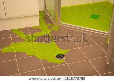 Shower leaking indicator dye flood test to check for leaks withing the shower pan base Royalty-Free Stock Photo #1818770780