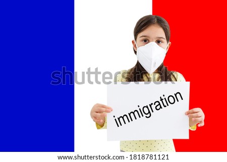 little girl in a protective mask against the background of the American flag. Concept of anxiety and fear, coronavirus pandemic in USA