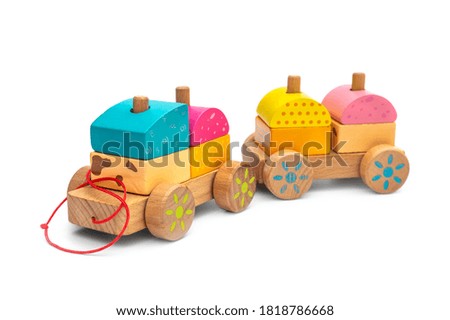 Stacking wooden toy train for little children on white background.