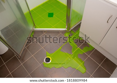 Shower leaking indicator dye flood test to check for leaks withing the shower pan base Royalty-Free Stock Photo #1818809984
