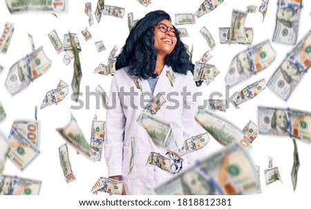 Beautiful african american optician woman with optometry glasses looking away to side with smile on face, natural expression. laughing confident.