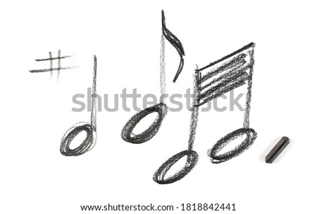 Graphite stick with musical notes hatching, sketching isolated on white background, top view Royalty-Free Stock Photo #1818842441