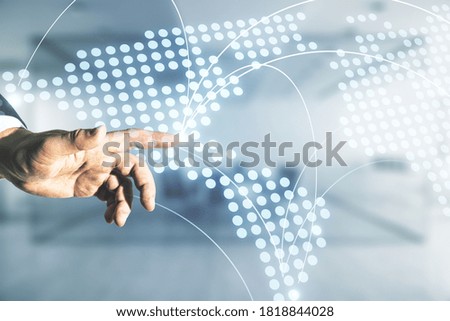 Man hand working with abstract virtual world map with connections on blurred office background, international trading concept. Multiexposure