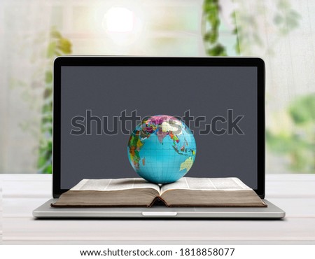 Classic globe planet, book and laptop computer