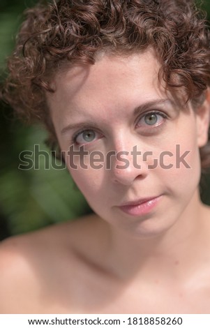 Beautiful Brazilian woman posing and looking at camera.