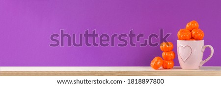 Halloween holiday concept with pumpkin decor on wooden table. Sale time.