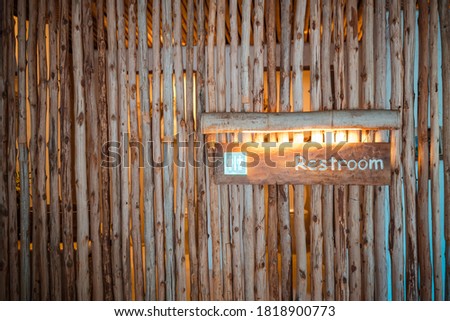 Toilet sign made of wood