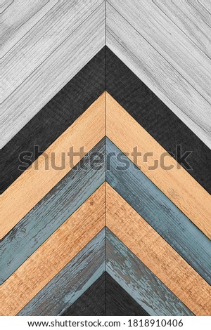 Colorful wooden panel with chevron pattern for wall decor. Wooden planks texture background.