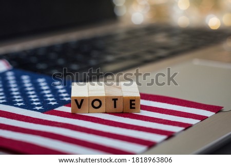 VOTE letter blocks concept on laptop keyboard